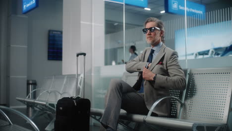 businessman waiting at airport lounge