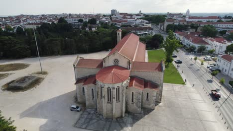 Igreja-de-santa-clara-in-santarém,-portugal,-showcasing-its-architecture-and-surroundings,-aerial-view