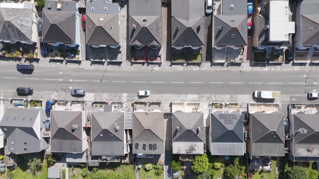 Aerial View of a Residential Street with Houses and Cars