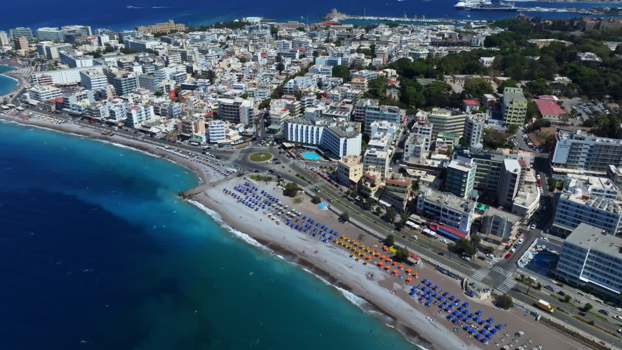 Aerial tilt shot in front of downtown Rhodes city, warm, sunny day in Greece