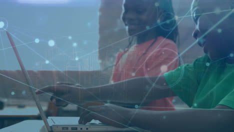animation of communication network over african american schoolchildren using laptops in class