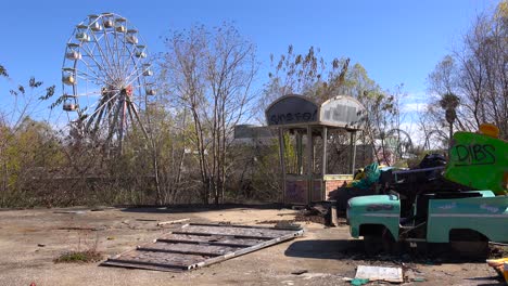 an abandoned and graffiti covered amusement park presents a spooky and haunted image