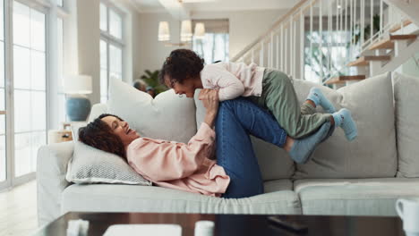 a happy family playing on the couch