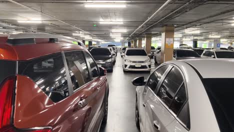 underground parking garage with many cars