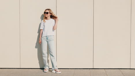 woman in white t-shirt and light blue jeans