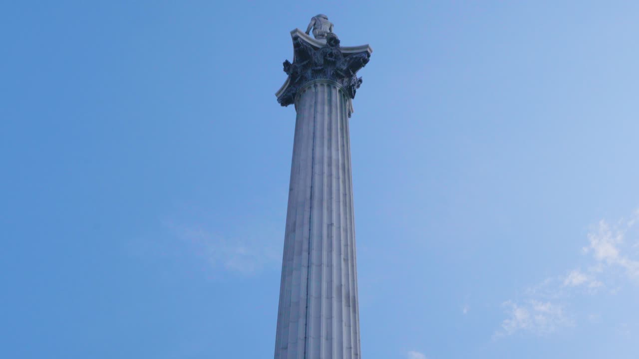 Close-up of a Tall Stone Column Against a Blue Sky