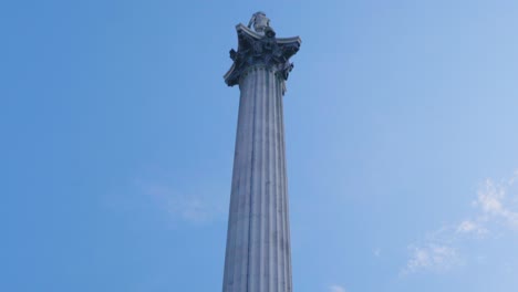 close-up of a tall stone column against a blue sky