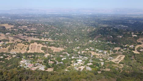 Aerial-view-of-the-countryside-and-vineyards,-in-Saratoga,-California---pan,-drone-shot