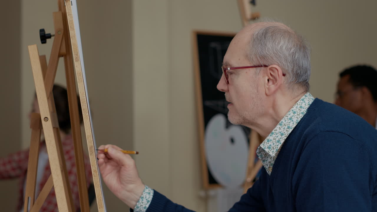Portrait of elder student using pencil to draw vase sketch