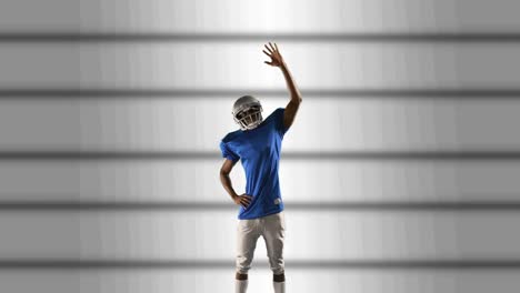 Male-rugby-player-wearing-helmet-celebrating-against-stripes-on-grey-background