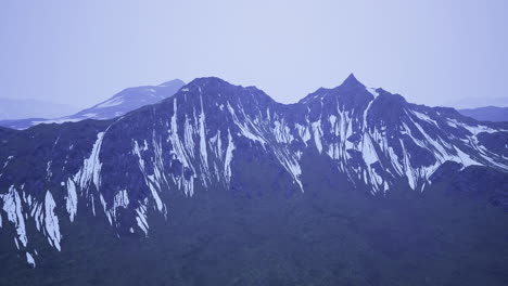 majestic mountain peaks dressed in snow heralding the change of seasons