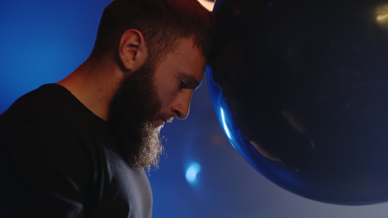 Man with head bowed in performance