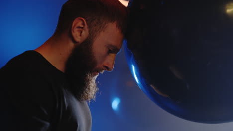 man with head bowed in performance