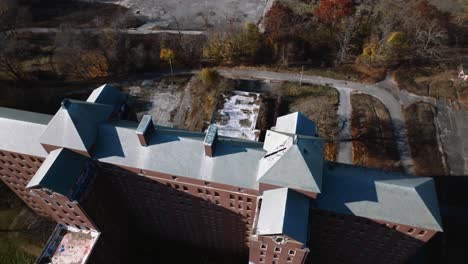 An-aerial-view-over-the-desolate-Kings-Park-Psychiatric-Center-on-a-sunny-day-on-Long-Island,-NY