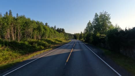 vehicle point-of-view driving a car on a road in norway