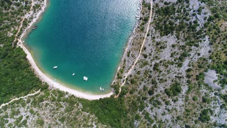 Natural-Beautiful-Sea-Bay-Coast-of-Pristine-Blue-Water-and-Warm-Forest-in-Pula-Sea-Croatia-Rakalj,-Aerial-Drone-View-Above-Travel-Destination