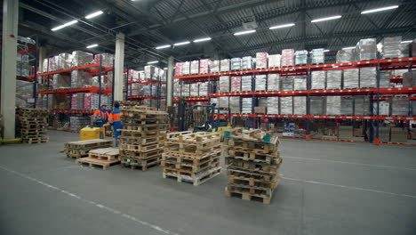 warehouse operations with forklift and palets