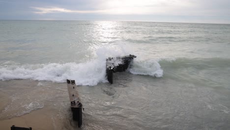 waves crashing on breakers in lake, michigan located in frankfort, michigan with stable wide shot video