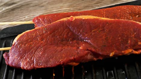 skewed raw meat on tray