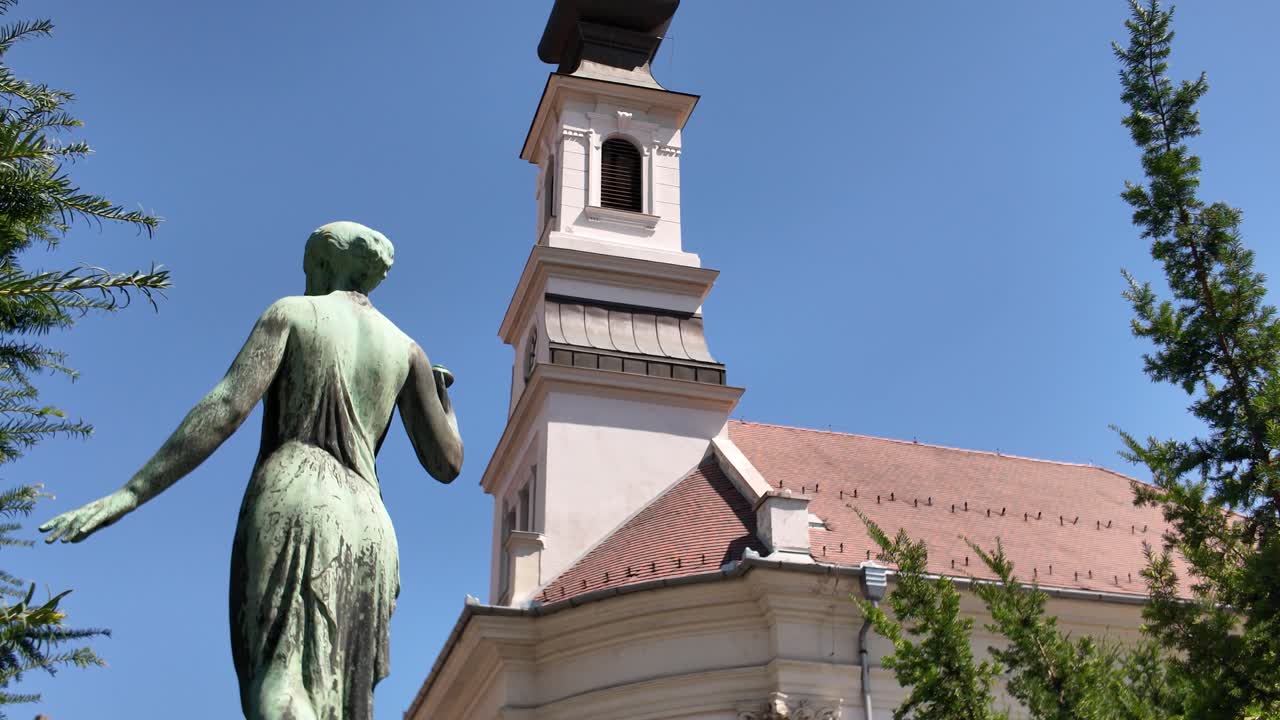 A historic statue standing near the Lutheran Church of Budavár in Budapest, Hungary