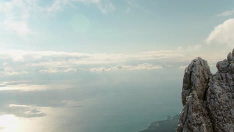 snowy mountain peak with ocean view