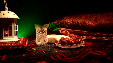 water and dates. iftar is the evening meal. slider view of decoration ramadan kareem holiday. festive greeting card, invitation for muslim holy month ramadan kareem. dark background. selective focus