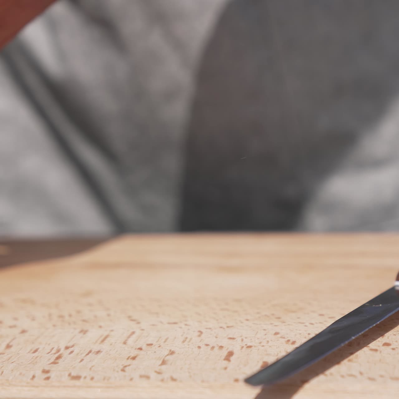 Male hands prepairing sausage for barbeque. Picnic bbq cooking tasty steak