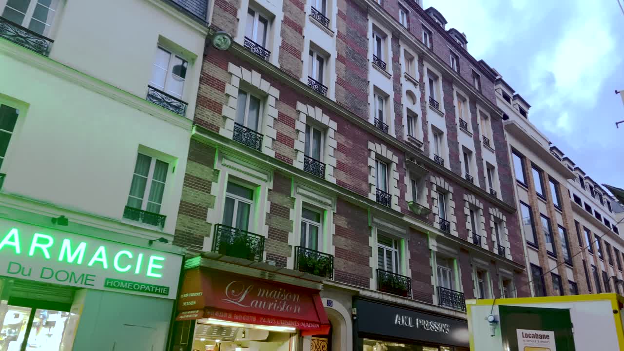 Buildings And Shops At The 8th Arrondissement Of Paris In France During Sunset - low angle trucking shot