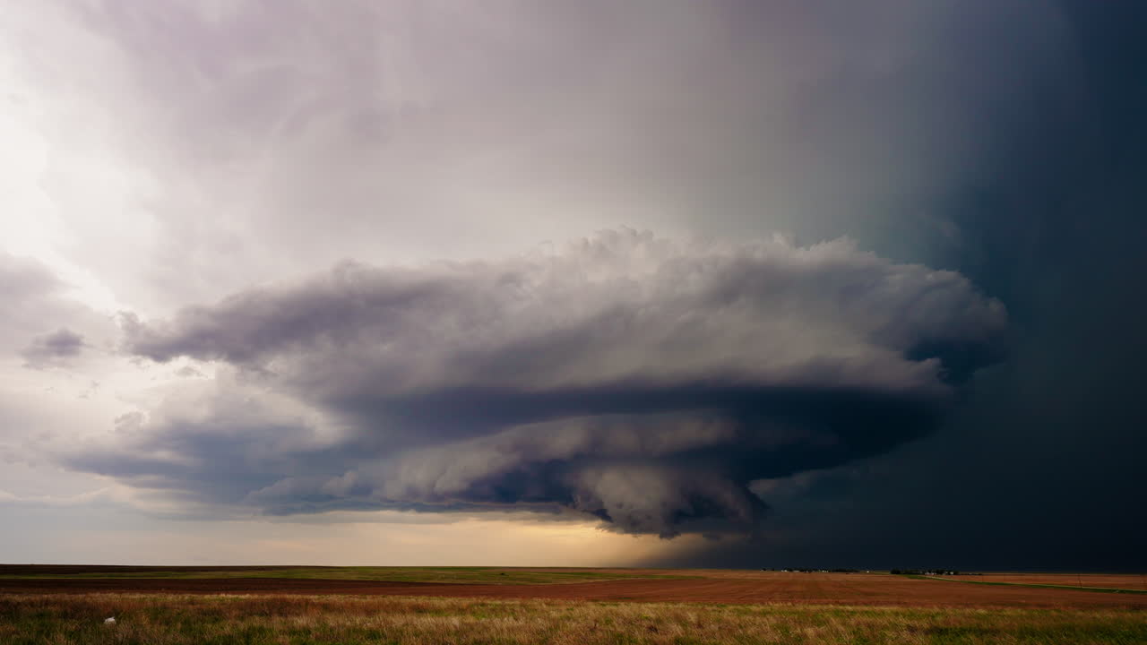 Dramatic Supercell Storm Cloud Over a Field