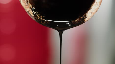 black oil dripping from a rusty pipe