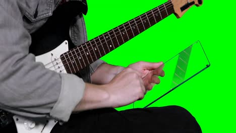 mid section of musician pretending to be using digital tablet