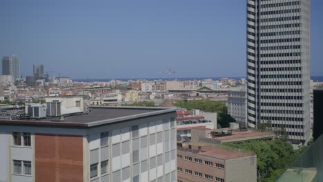 Overview-of-Early-Morning-Barcelona-as-Birds-Fly-Along-City-Skyline-in-Spain-in-6K