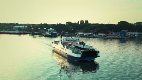 drone point of view on a channel ferry moving slowly towards
