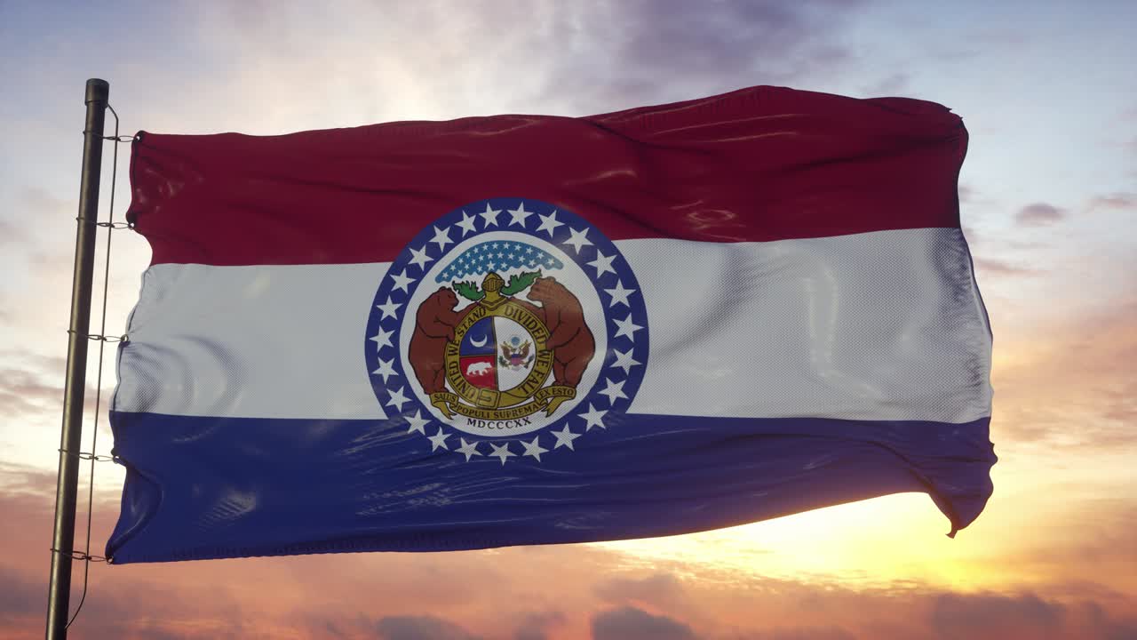 Flag of Missouri waving in the wind against deep beautiful sky at sunset