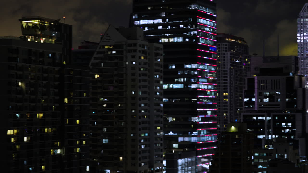 Bangkok Dense City Skyline at Night Wide Pan Shot, Endless Skyline in Metropolis, Light Pollution and Illuminated Buildings at Night