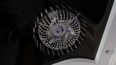 close-up of beautiful crystal chandelier round shape hanging from the ceiling in the interior