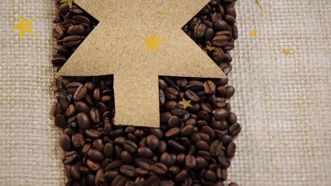 Gold star confetti drifting over corkboard tree as top piece lifting revealing coffee beans