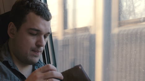 Man-checking-his-wallet-in-the-train