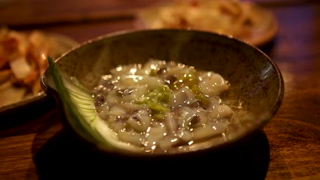 close-up of tako wasabi dish with garnish