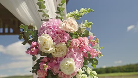 wedding decoration featuring flowers in soft pink and cream colors, creating an elegant and romantic atmosphere