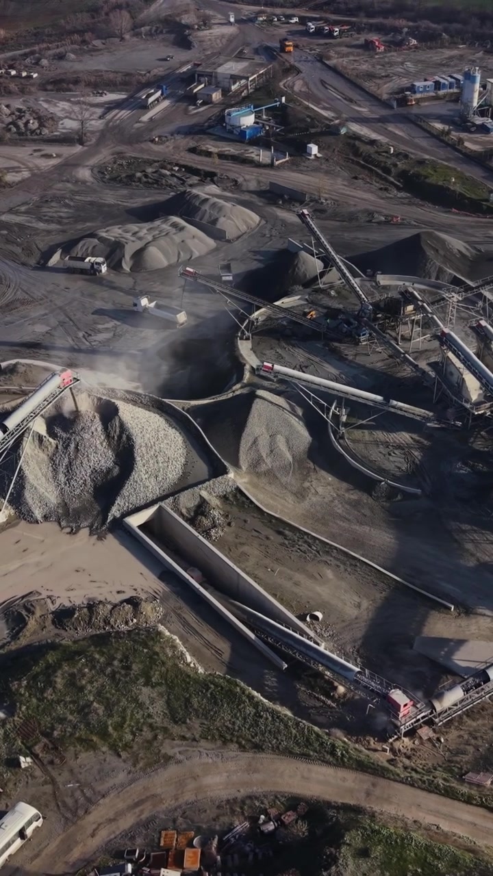 Mining happens in a quarry using machinery and conveyors