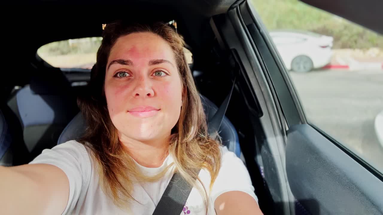 Young Woman Creating Vlog Inside Car