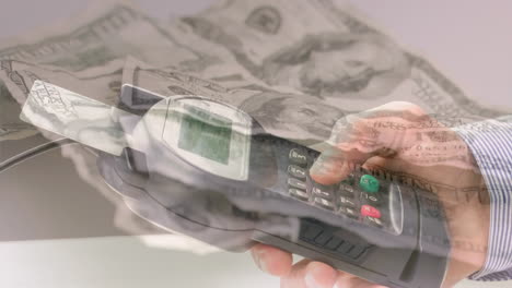 animation of dollar banknotes falling over hand of caucasian man holding payment terminal