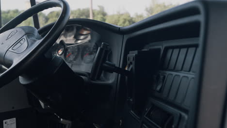 closeup steering wheel dashboard in driver cabin. safety transport interior.