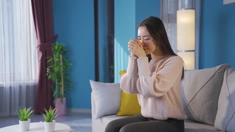 Unhappy-woman-praying-wishes-and-hopes-well-at-home.