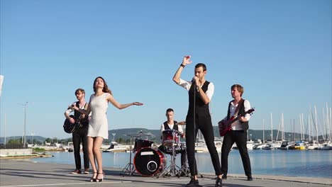 band performing at waterfront venue