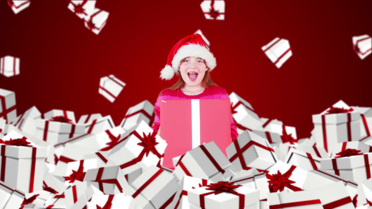 Bambina natalizia con regali di Natale in caduta