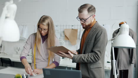 fashion designers collaborating in a design studio