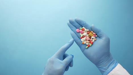 doctor holding a variety of pills in their hands