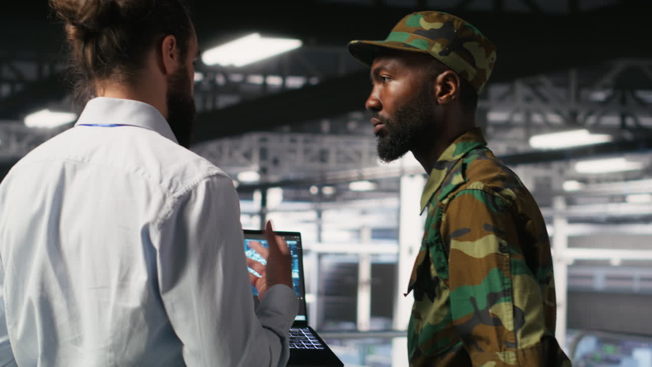 Army technicians in command center server room using artificial intelligence